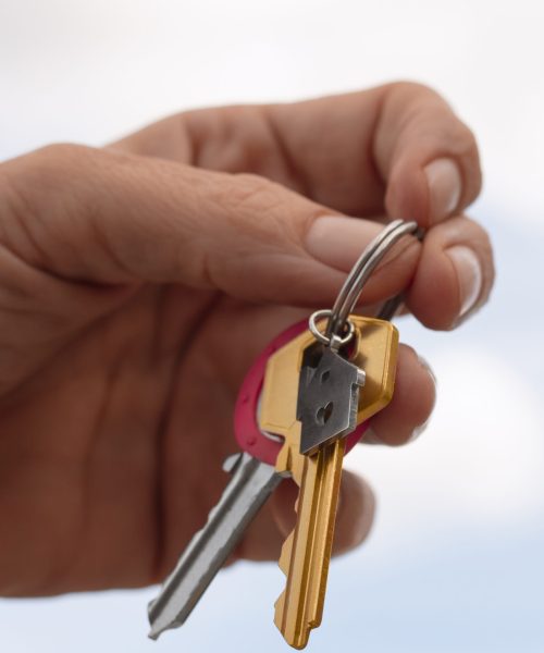 hand-holding-keys-outdoors